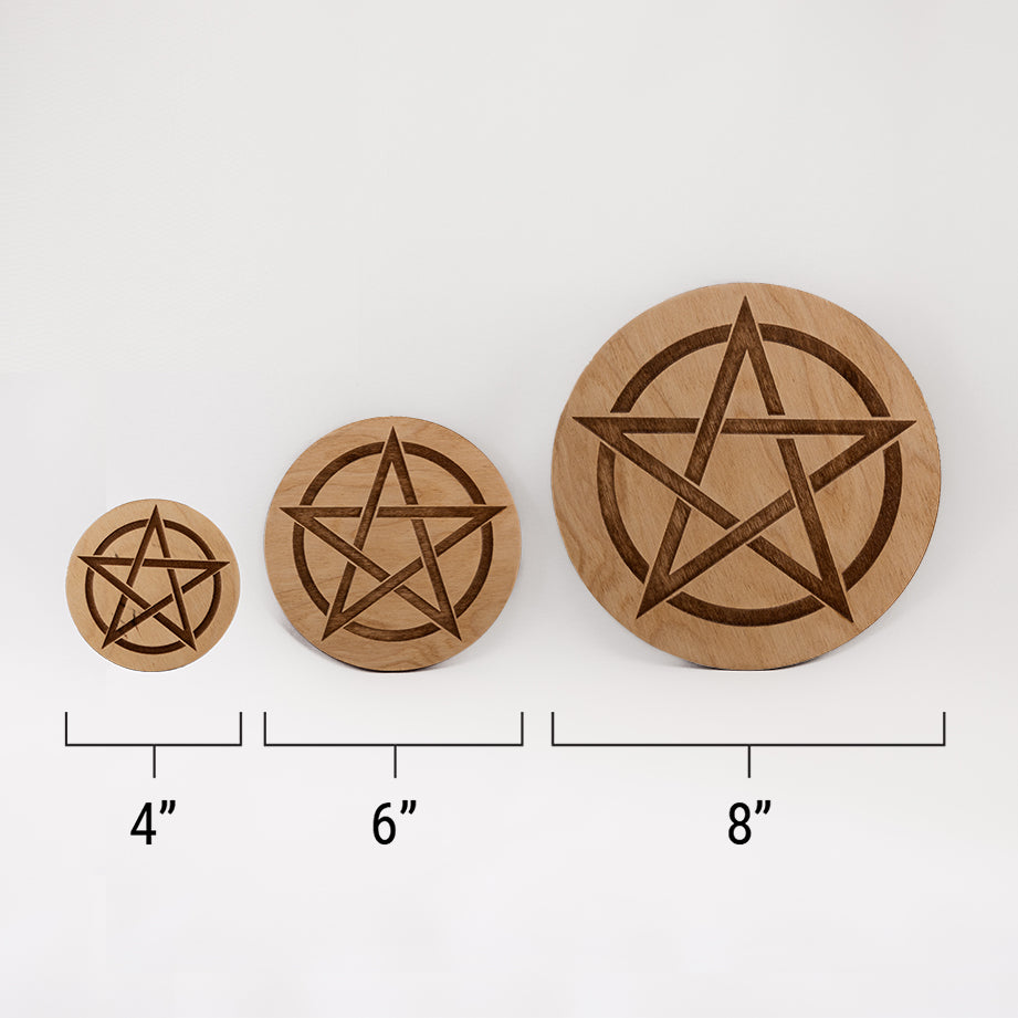 Three different sizes of the circular wooden laser-cut crystal grid engraved with a Pentacle. against a white background with a ruler underneath all three. The smallest measuring 4", the middle 6", and the largest 8".