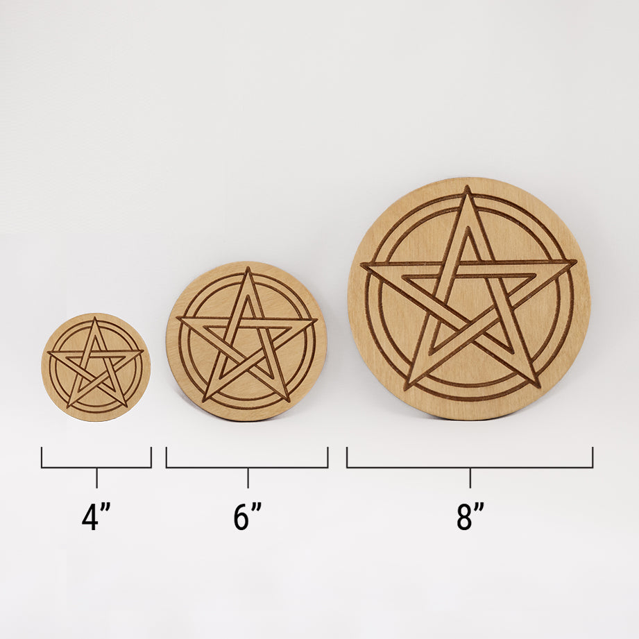 Three different sizes of the circular wooden laser-cut crystal grid engraved with a Pentacle. against a white background with a ruler underneath all three. The smallest measuring 4", the middle 6", and the largest 8".