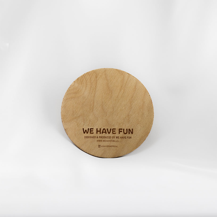 Back of the circular Baltic birch crystal grid with "We Have Fun" logo, "Designed and produced by We Have Fun", "www.wehavefun.lol", and instagram bio link "wehavefunofficial" engraved on the back.