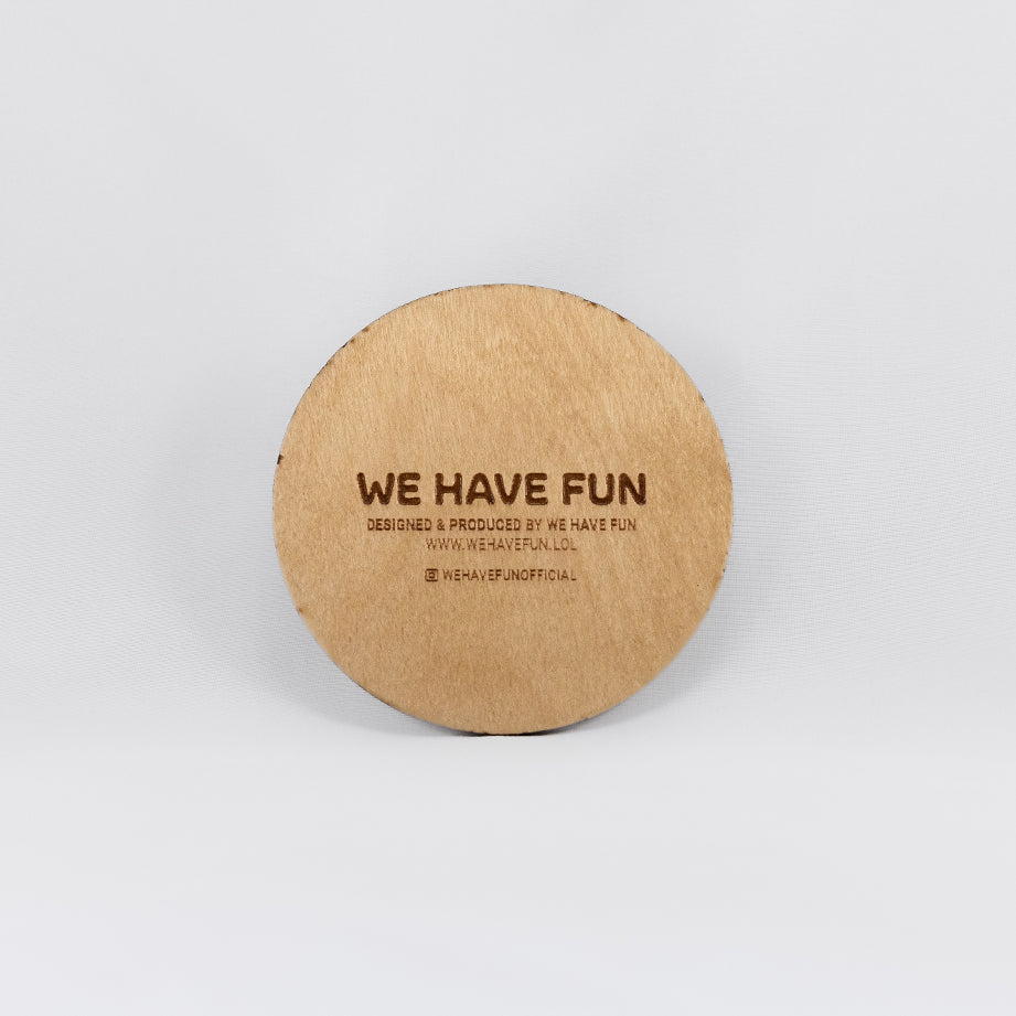 Back of the circular Baltic birch crystal grid with "We Have Fun" logo, "Designed and produced by We Have Fun", "www.wehavefun.lol", and instagram bio link "wehavefunofficial" engraved on the back.