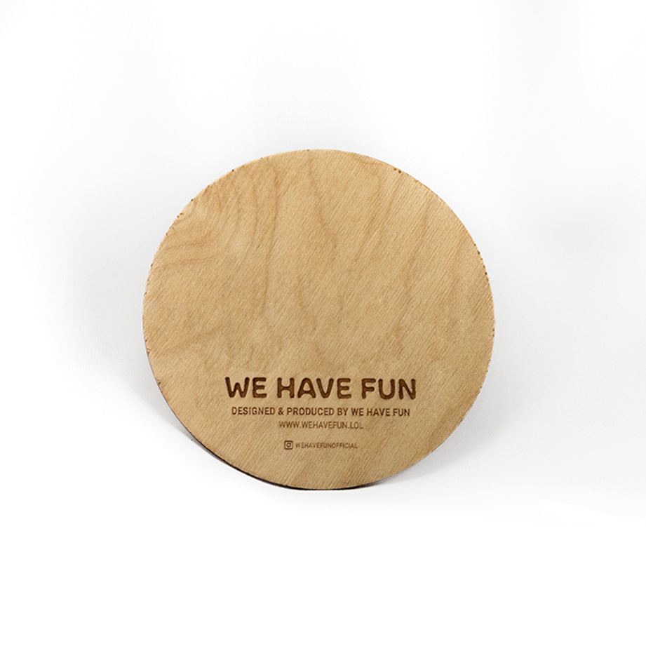 Back of the circular Baltic birch board with "We Have Fun" logo, "Designed and produced by We Have Fun", "www.wehavefun.lol", and instagram bio link "wehavefunofficial" engraved on the back.